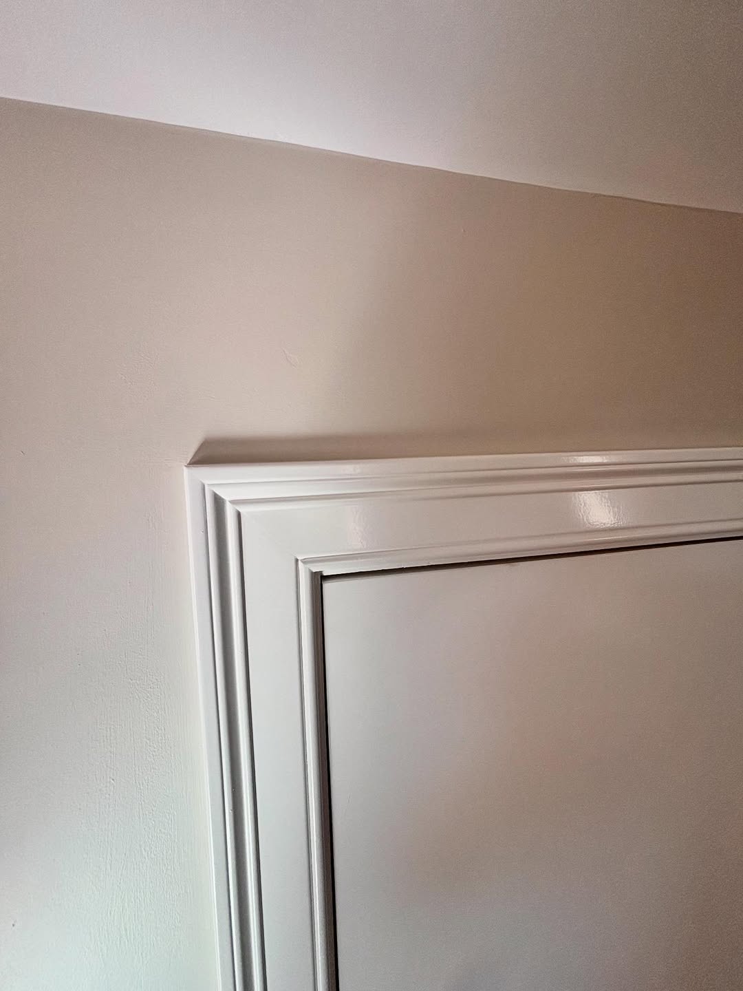 Hand-finished door casing — layered millwork detail