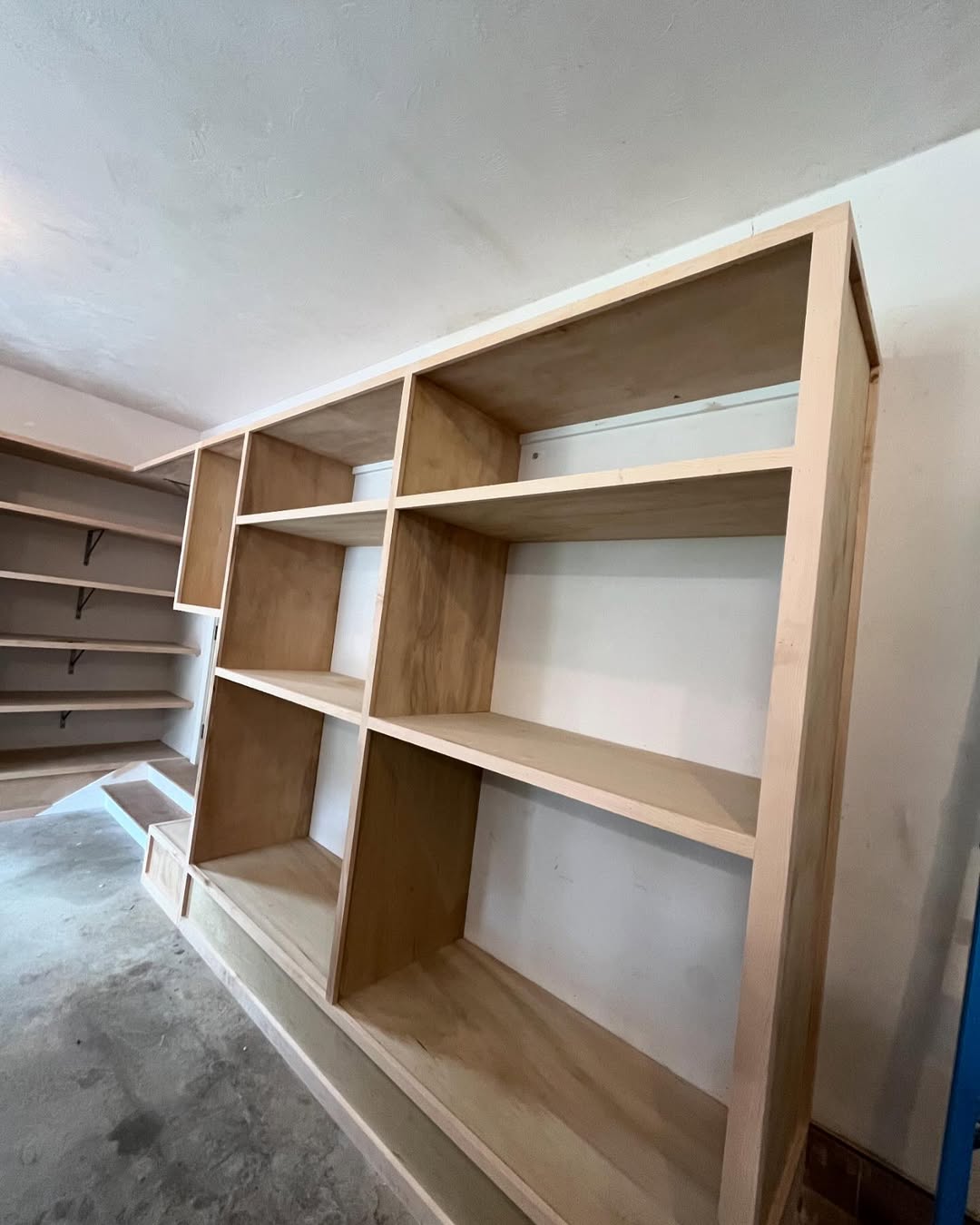 Detail of cubby joinery — clean dado and shelf work