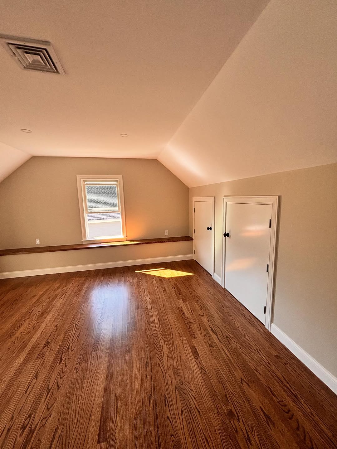 Vaulted attic suite — refinished red oak hardwood floors