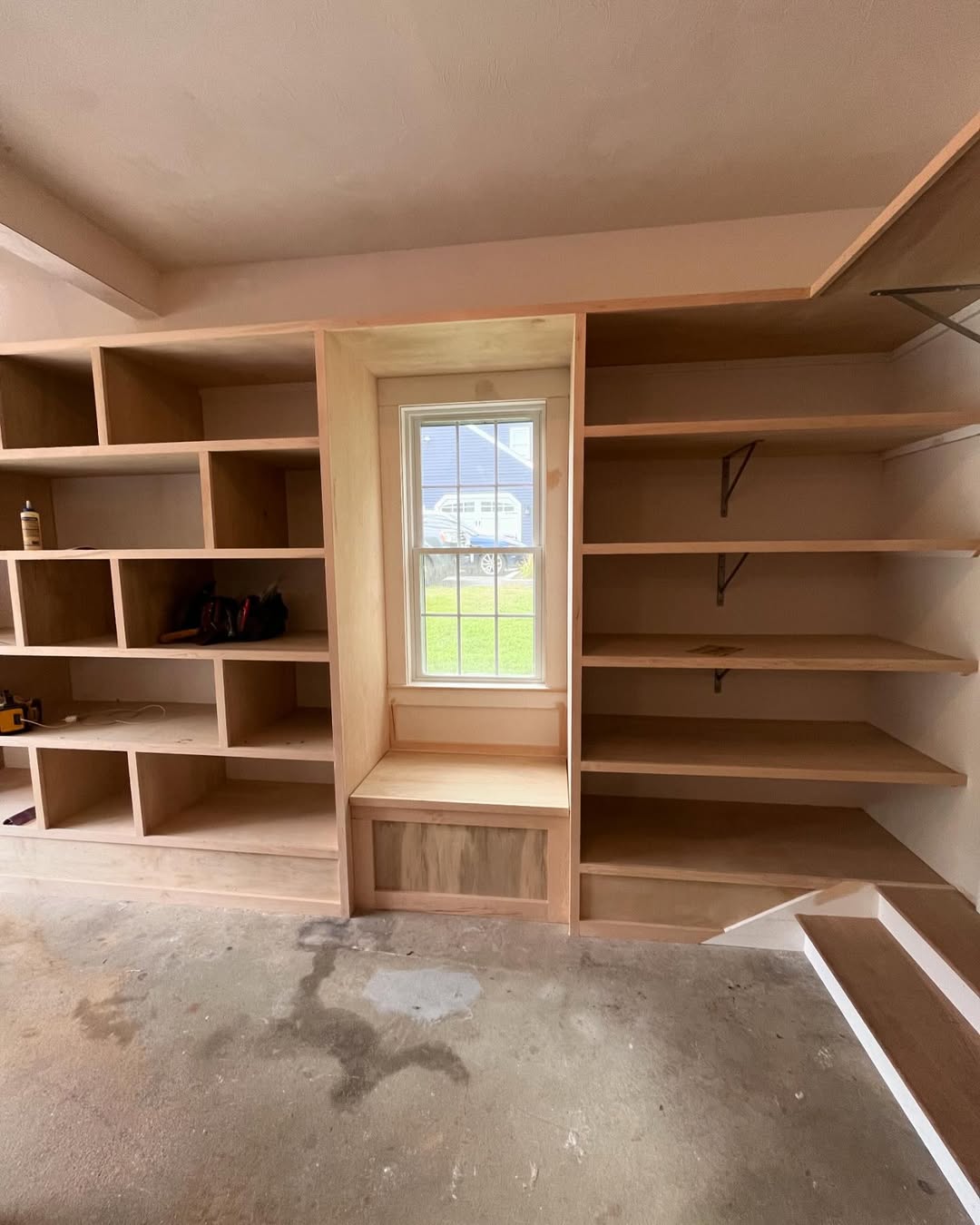 Built-in shelving and window bench — raw stock ready for finish