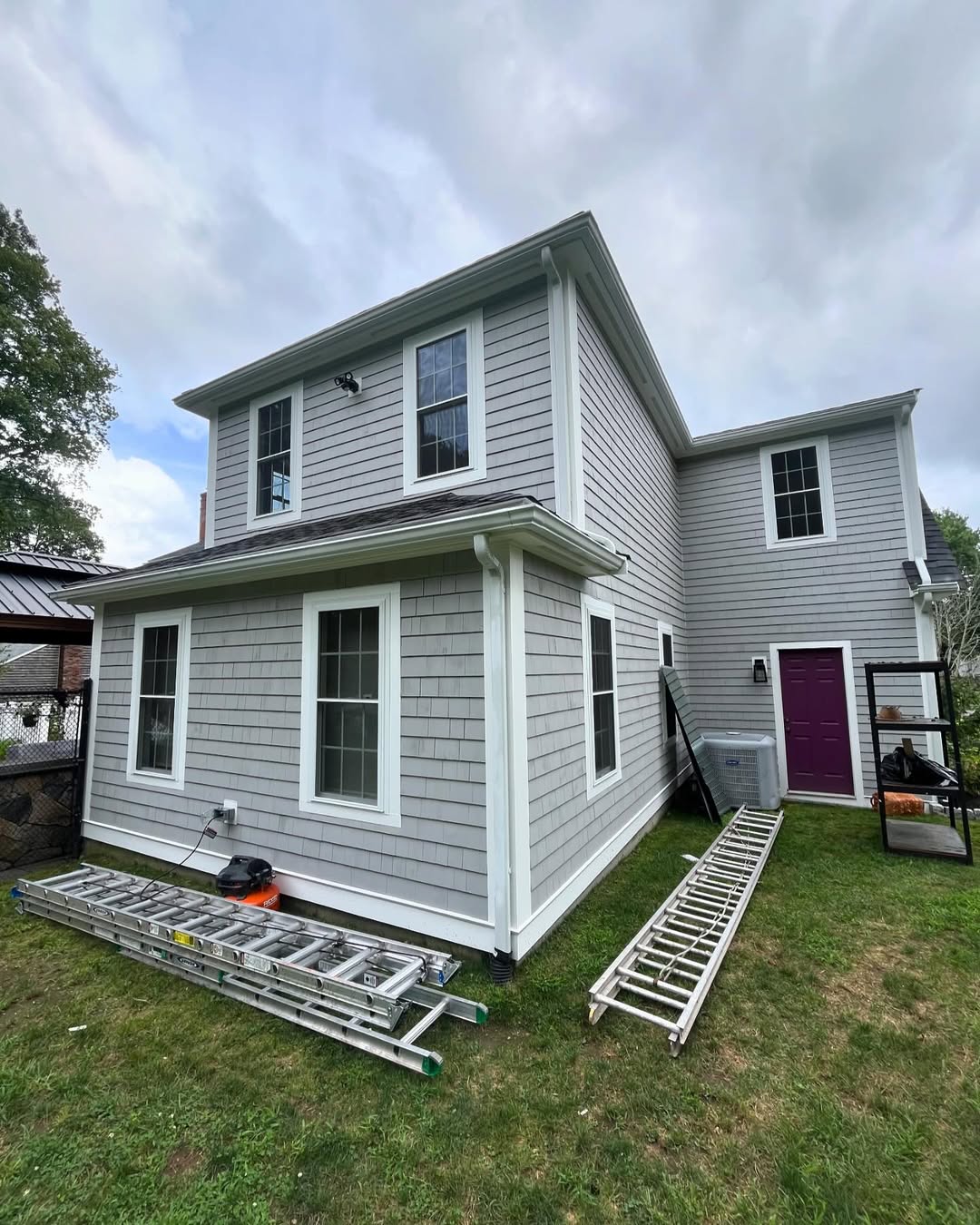 Side elevation — replaced siding, gutters and finish work