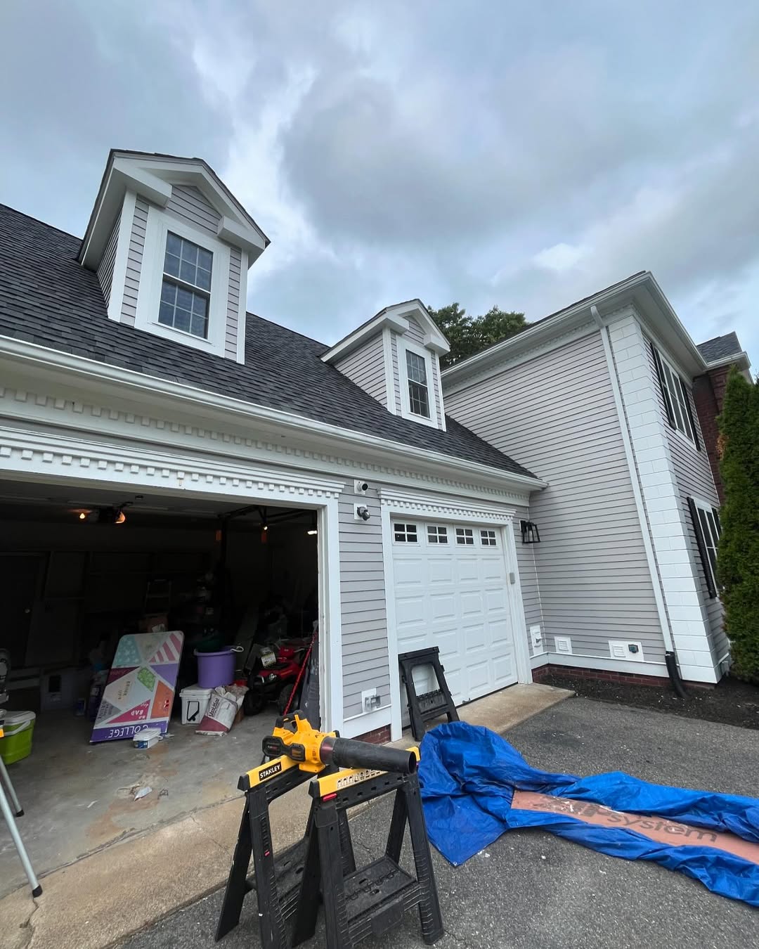 Front garage detail — new siding and dentil trim finish