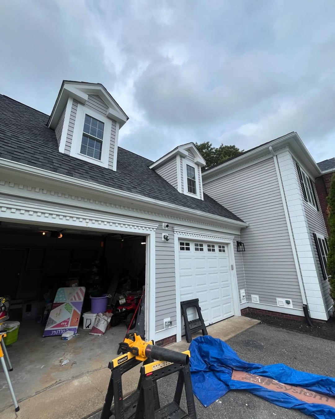 Garage and dormers — siding and gutter replacement in progress